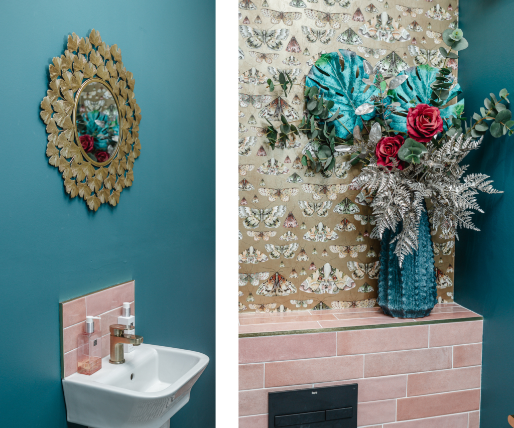 Small bathroom with gold patterned wallpaper featured wall and pink tiles