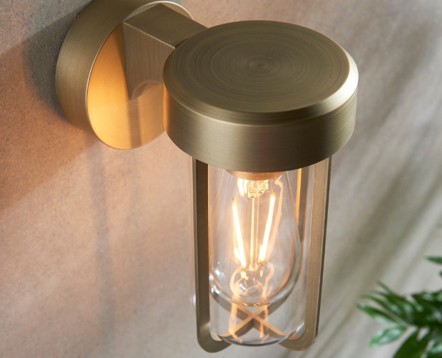 Brushed gold finish & clear glass wall light 