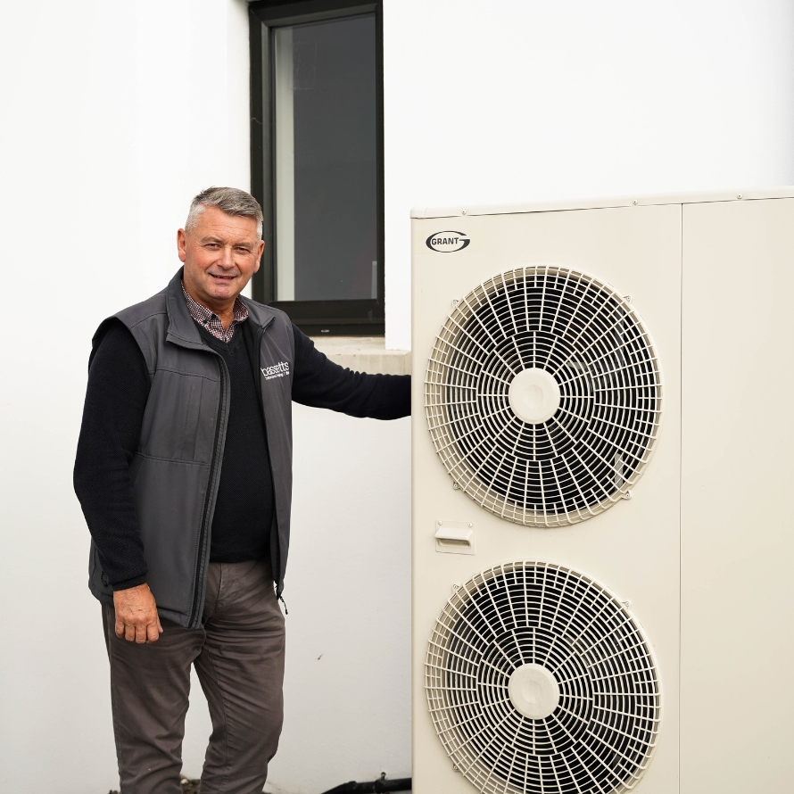 Bassetts Energy Consultant Chris McCready with Grant Aerona Air Source Heat Pump